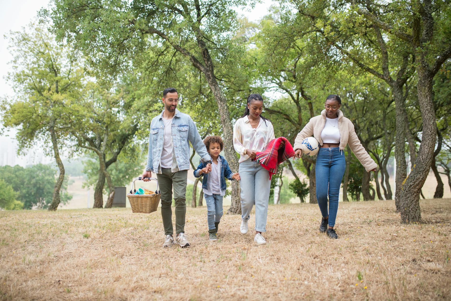 Japanese family enjoying leisure time together in a city park on weekend