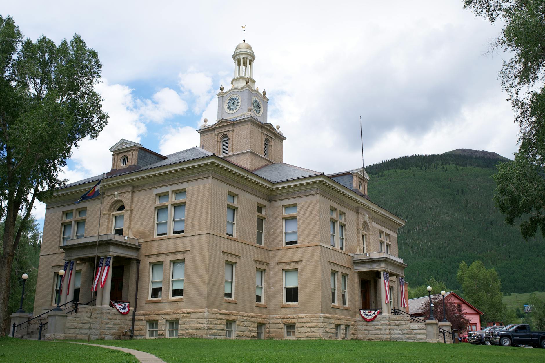 American flag displayed outside courthouse symbolizing justice system and constitutional governance