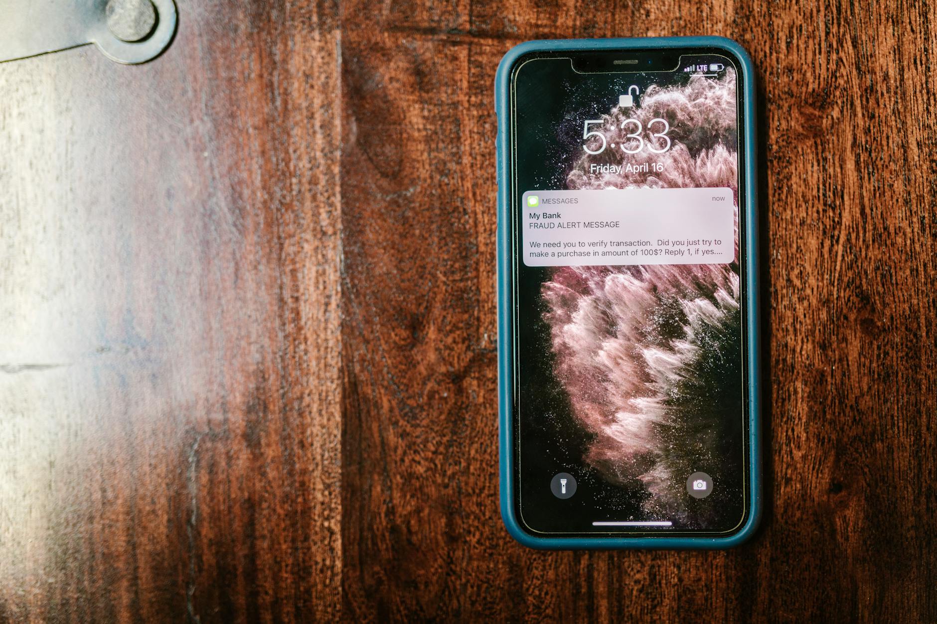 Mobile phone displaying security notification and data breach warning message