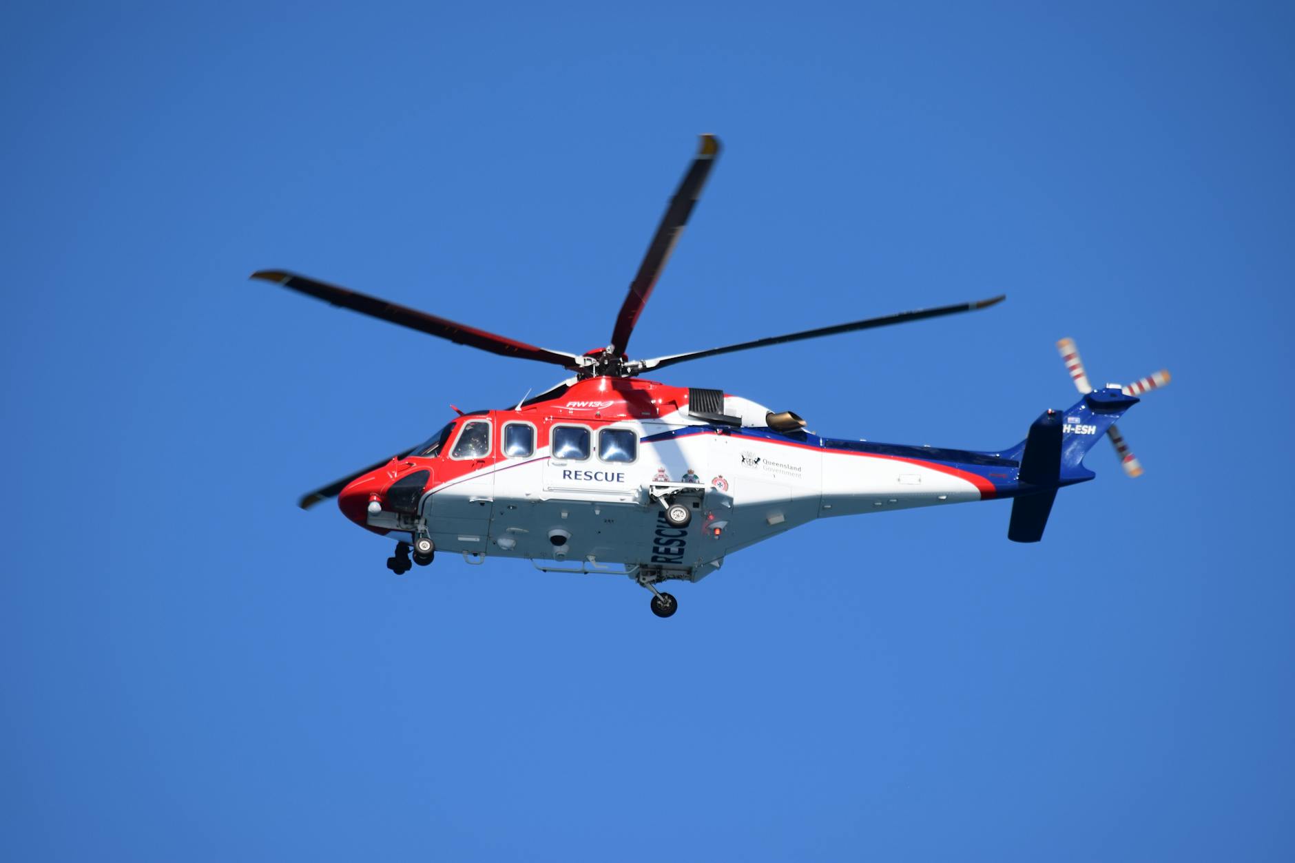 Emergency response helicopter conducting firefighting operations from above