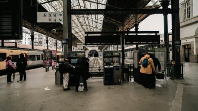 Busy train station platform with passengers waiting for transport
