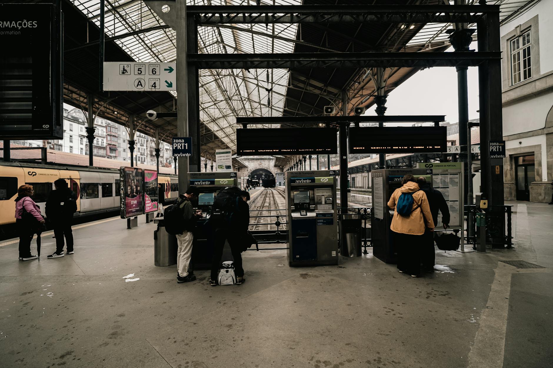 Busy train station platform with passengers waiting for transport