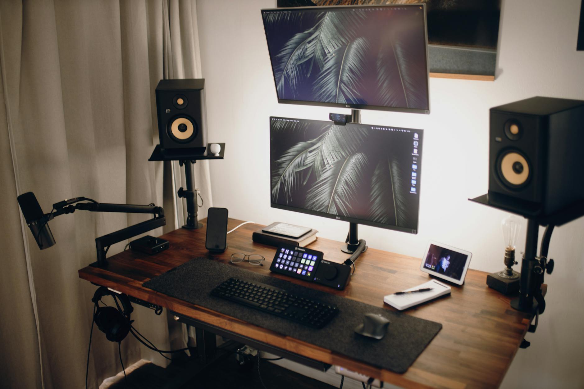 Modern streaming setup with multiple monitors and recording equipment