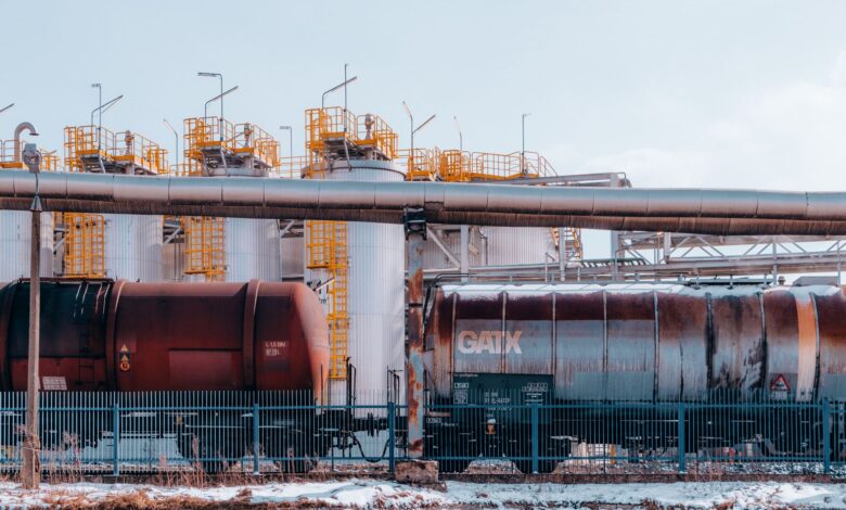 Large oil pipeline stretching across open terrain representing global crude supply infrastructure