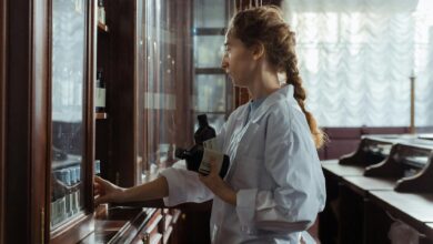 Modern pharmacy interior with consultation counter and medication shelves