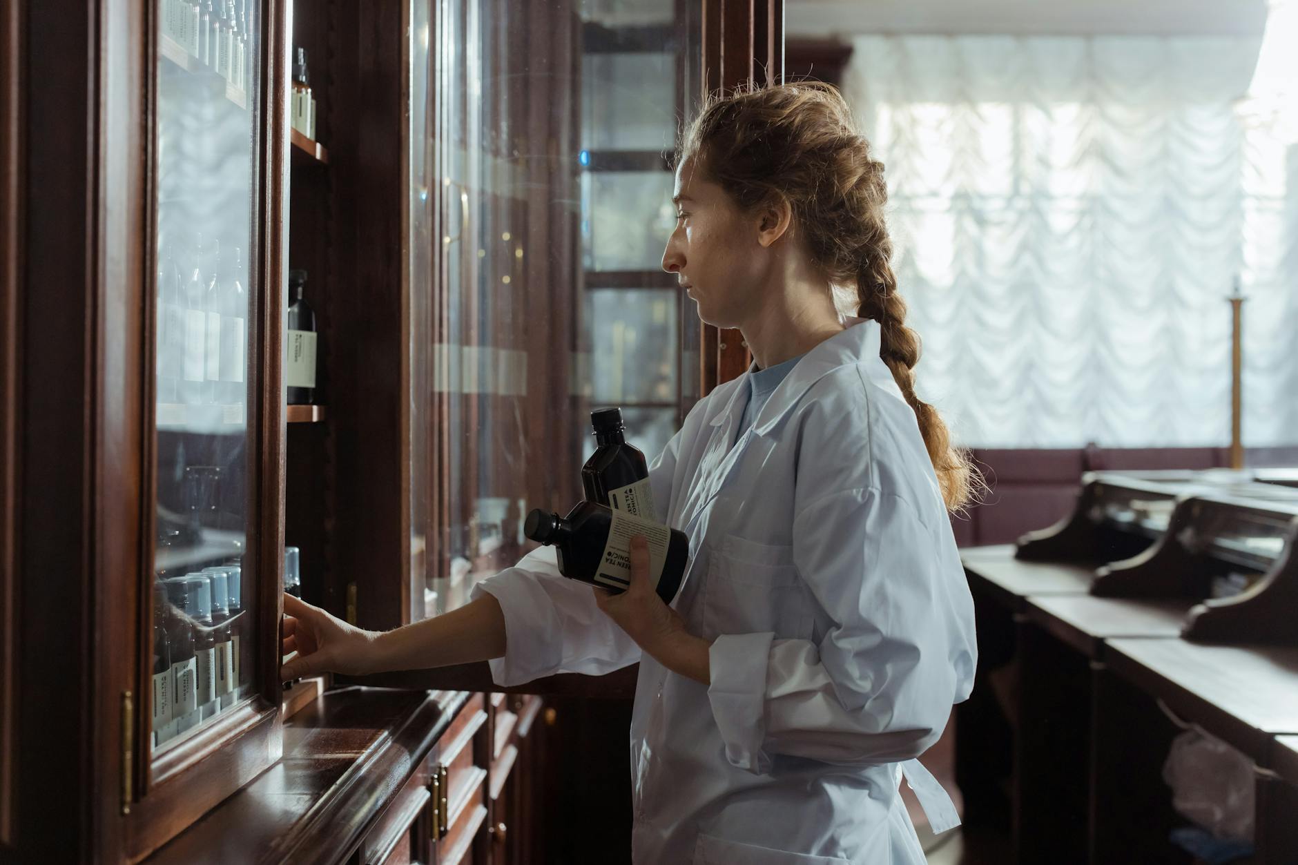 Modern pharmacy interior with consultation counter and medication shelves