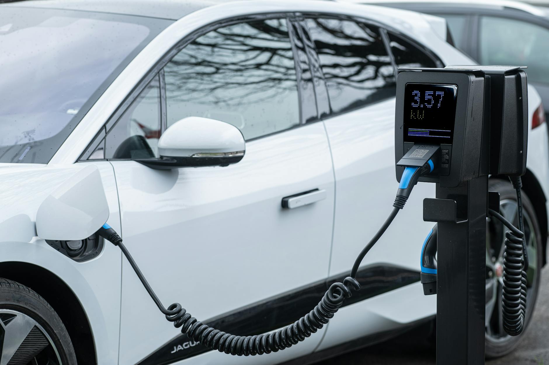 High-voltage electric vehicle charging station with industrial power equipment