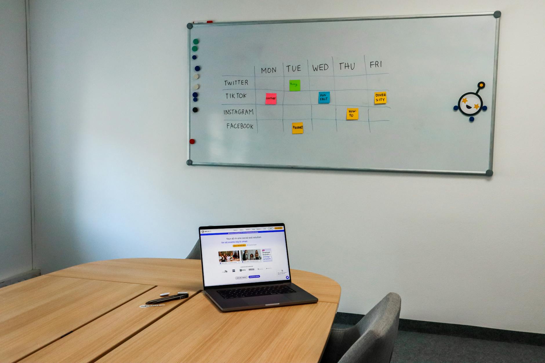 Marketing professionals reviewing digital ad campaign data on computer screens
