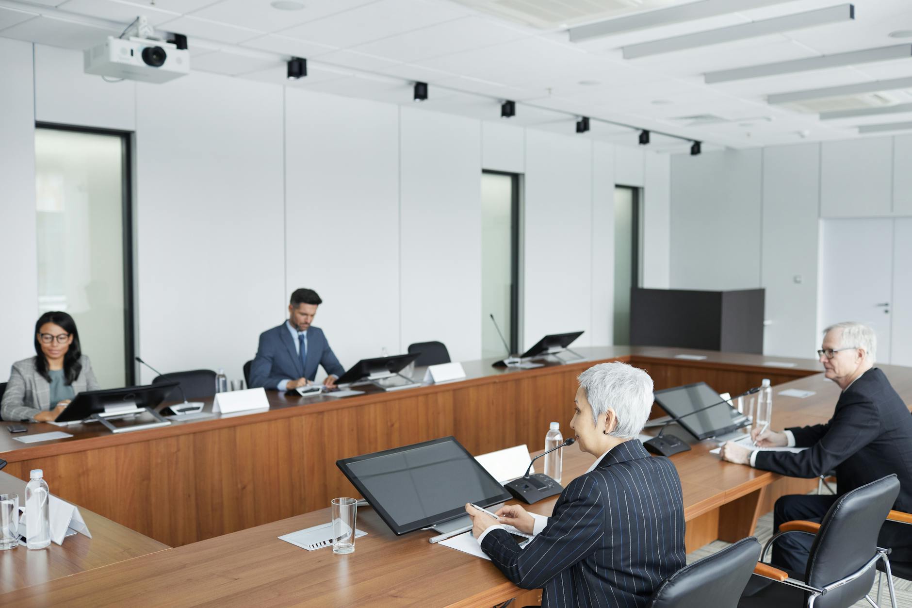 Corporate executives in boardroom discussing strategic business decisions