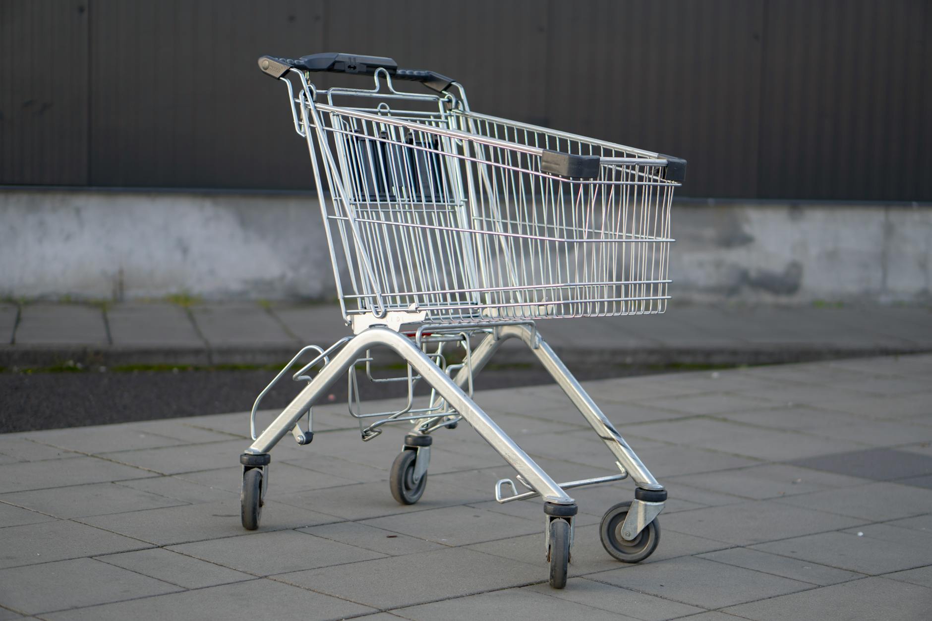 Shopping cart filled with bulk grocery items and household products