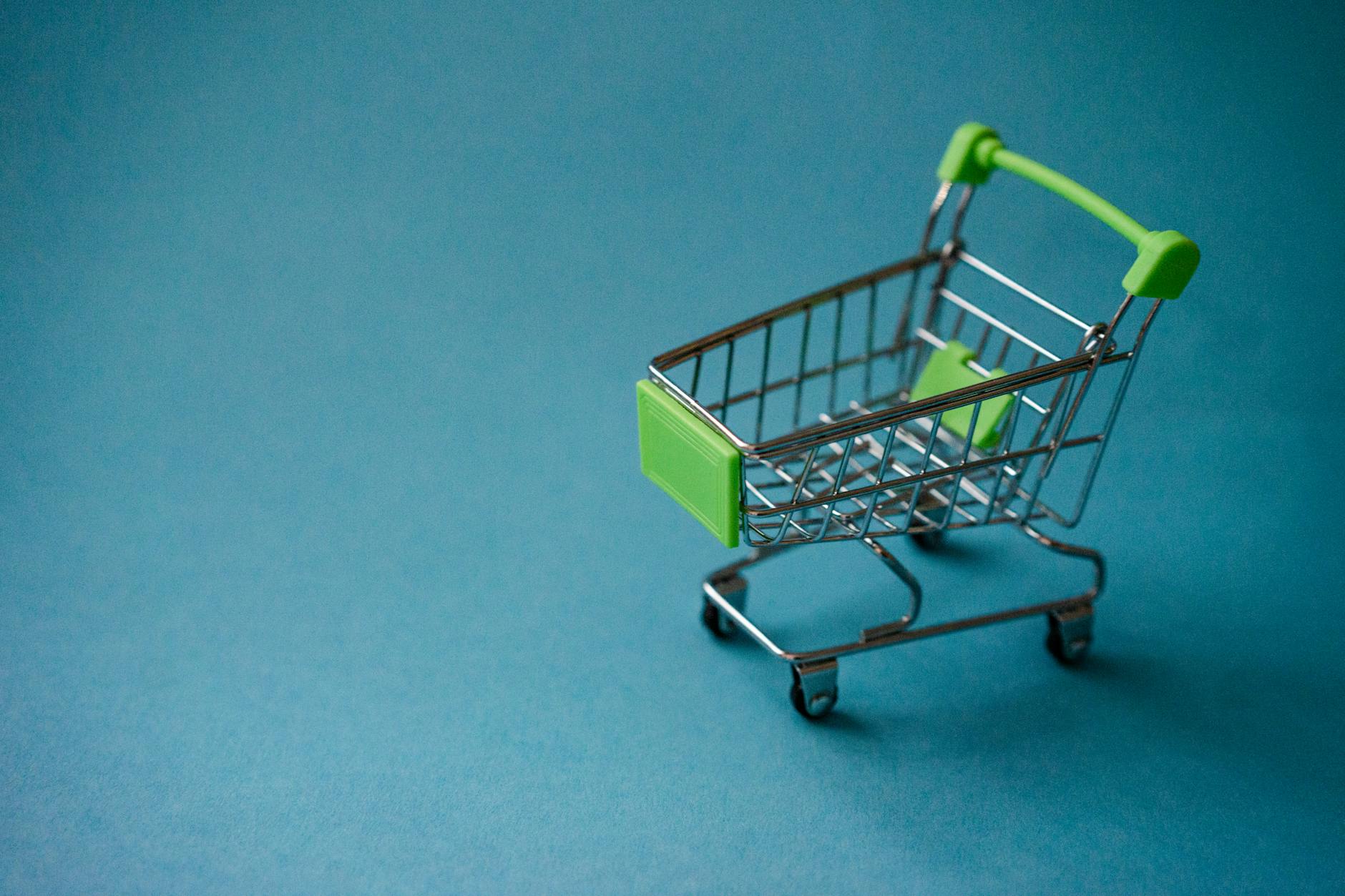 Shopping cart in grocery store aisle representing customer shopping experience