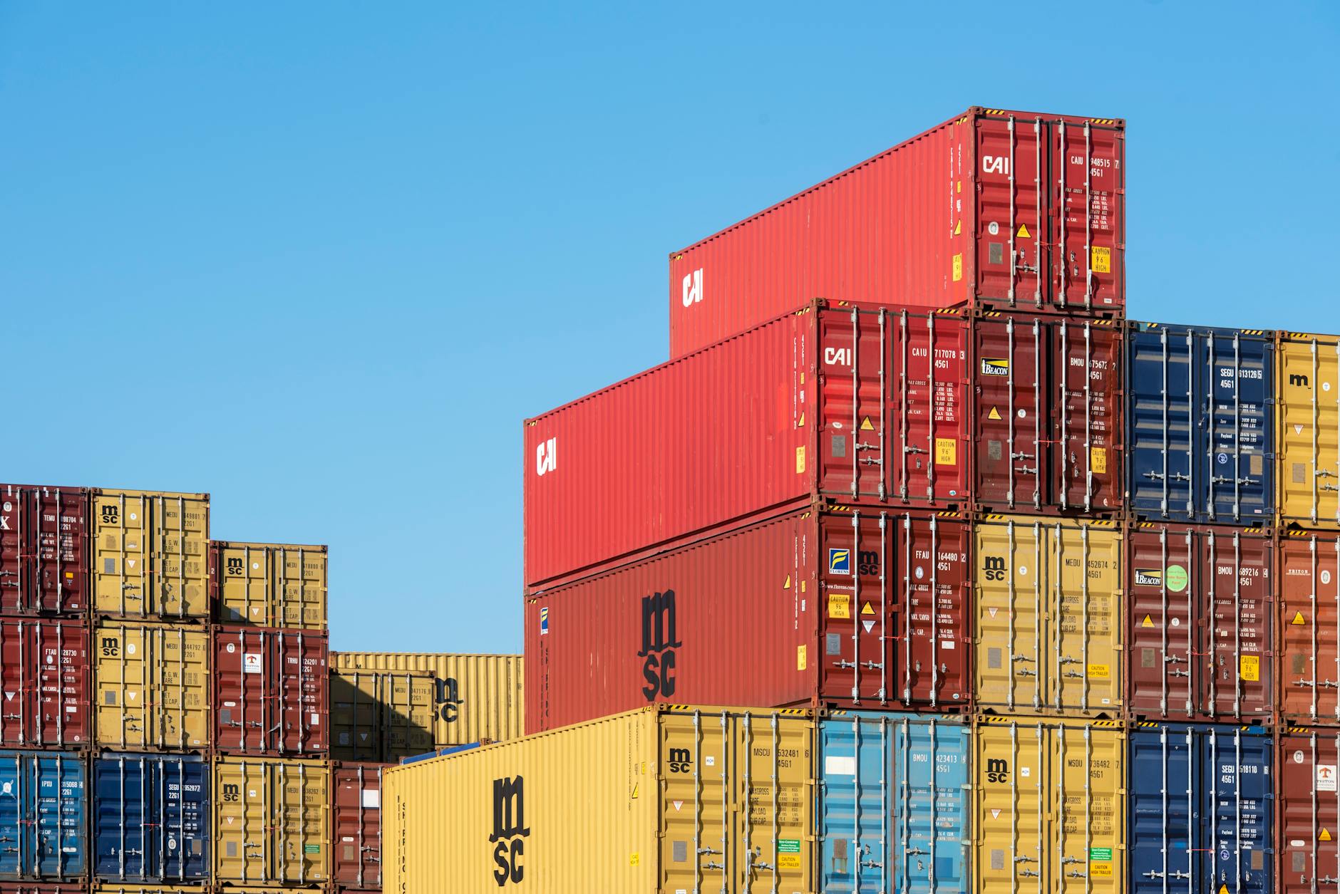 Cargo containers and logistics infrastructure representing global supply chain operations