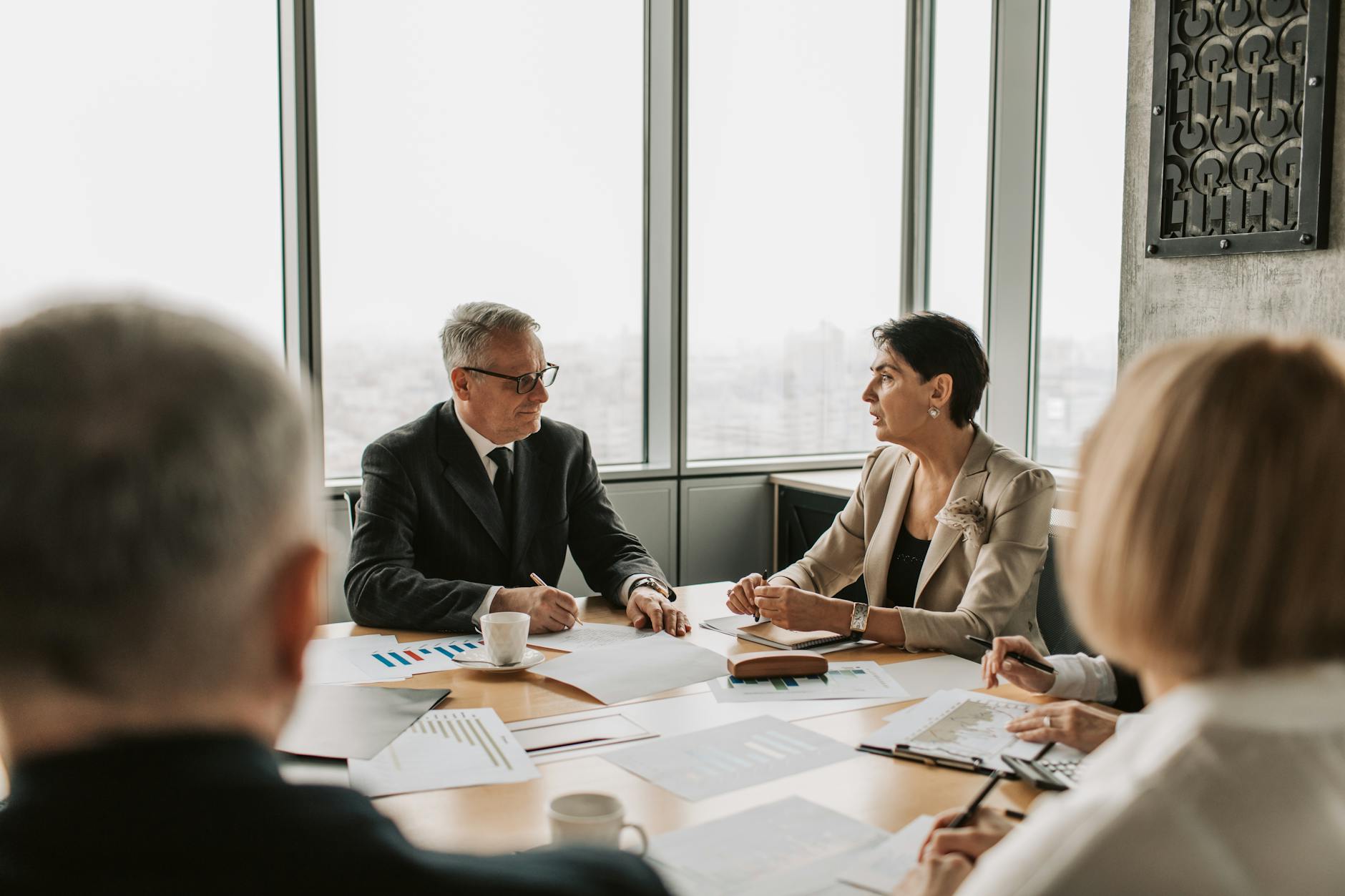 Executives in a boardroom discussion representing corporate IPO strategy planning