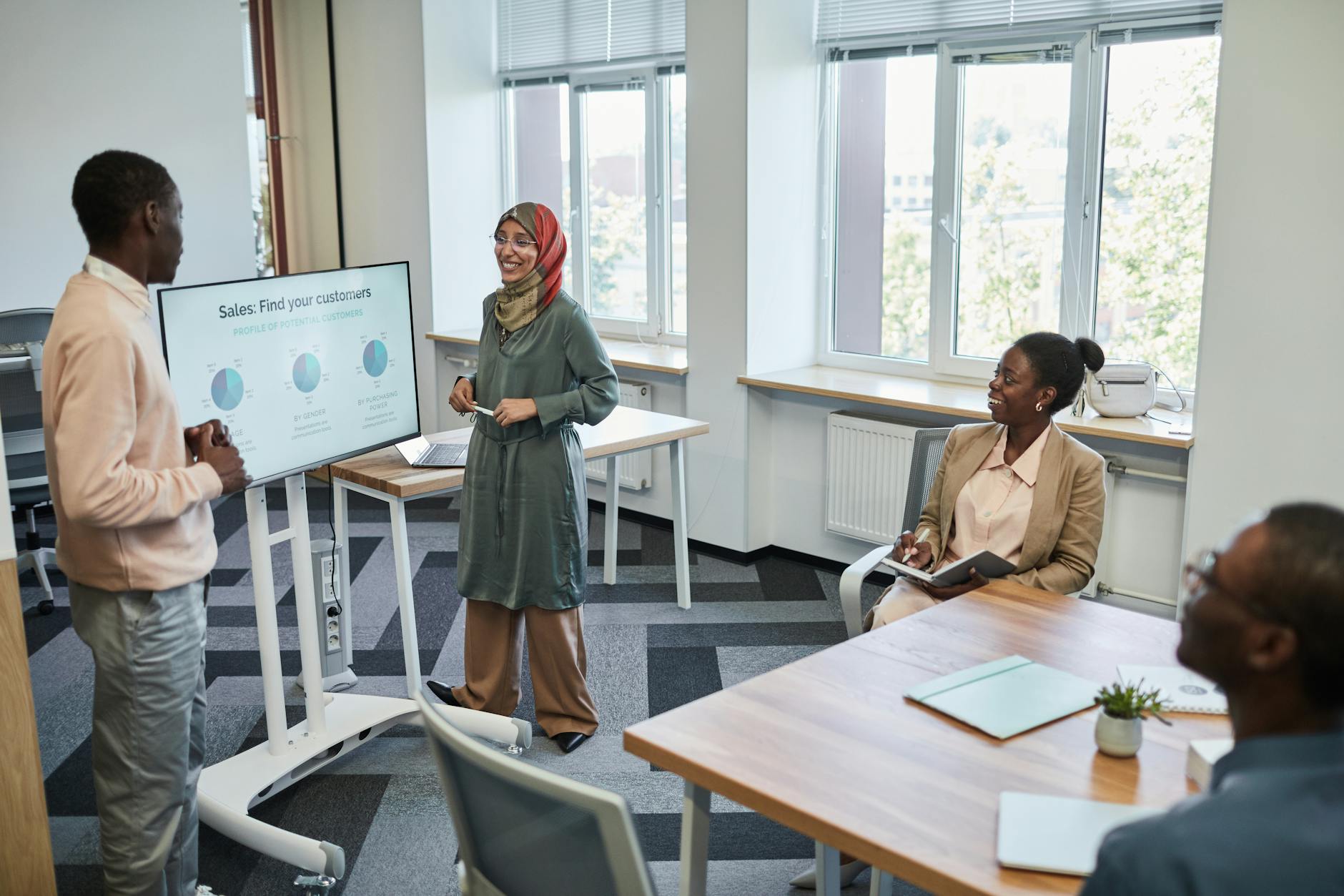 Sales professionals in a meeting discussing business strategy