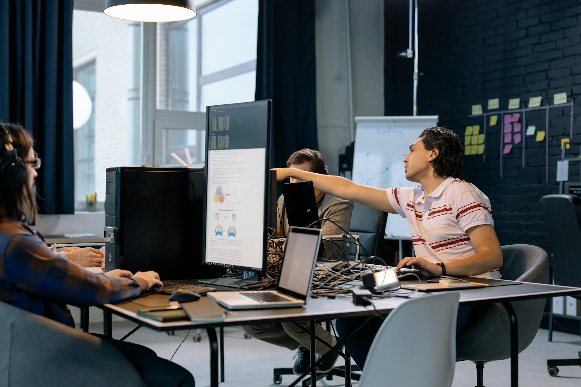 Business professionals in a meeting discussing advertising strategy and technology