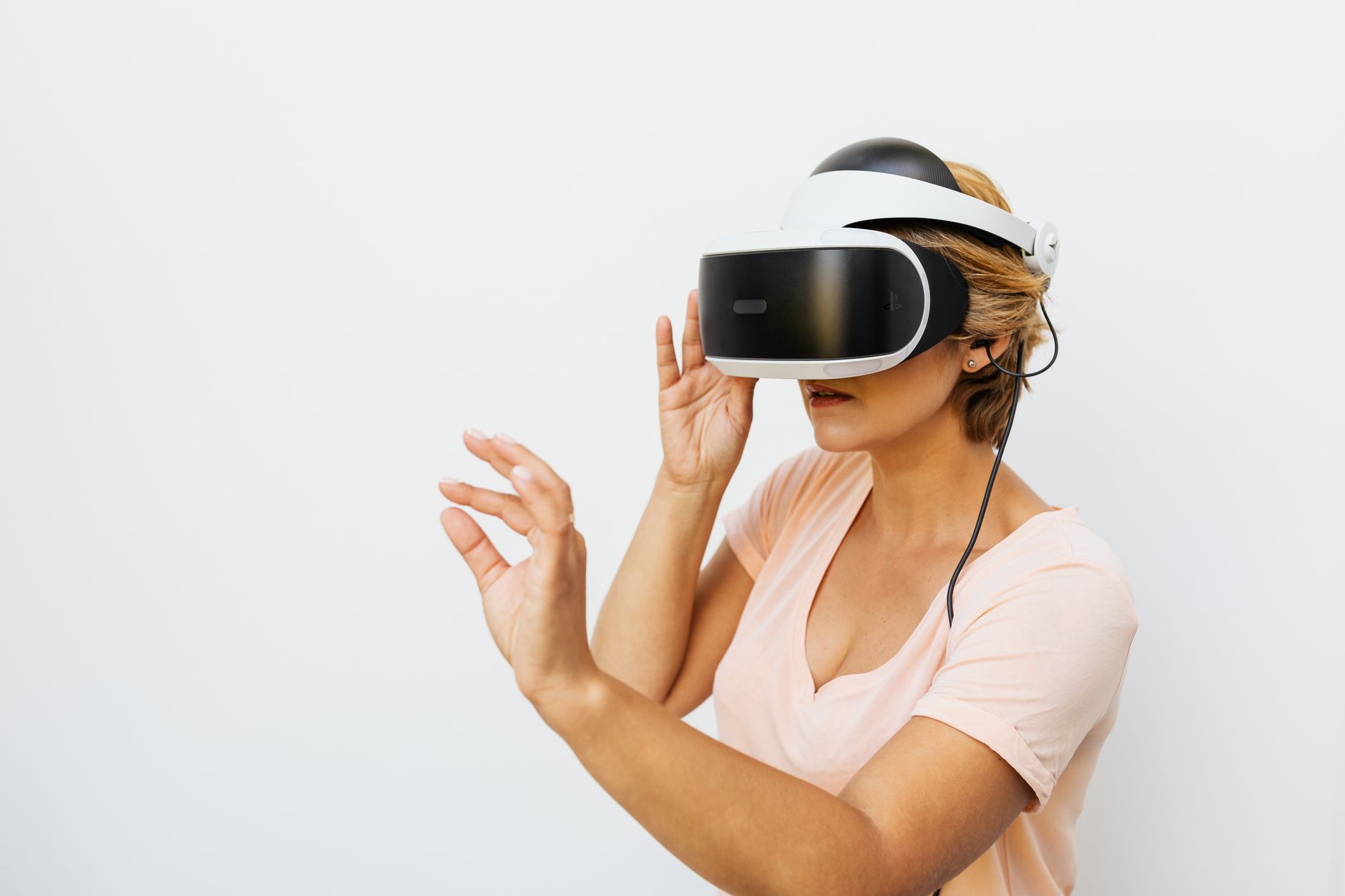 Person wearing a virtual reality headset in a modern setting