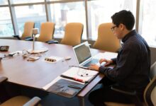 Business professionals discussing AI technology strategy in a corporate meeting room
