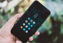 Person scrolling through a social media app on a smartphone