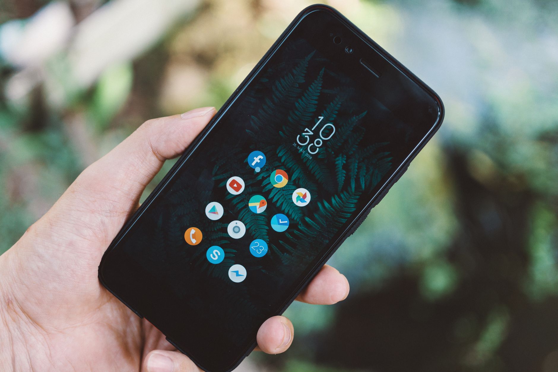 Person scrolling through a social media app on a smartphone
