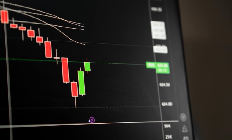 Traders working on a busy stock market trading floor representing asset management activity