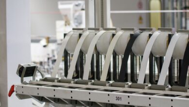 Workers on a modern electronics assembly line in a large manufacturing facility