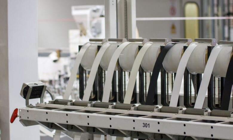 Workers on a modern electronics assembly line in a large manufacturing facility