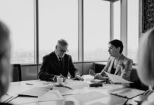 Financial advisor meeting with client in a modern wealth management office