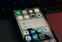 Person browsing app store on a smartphone screen
