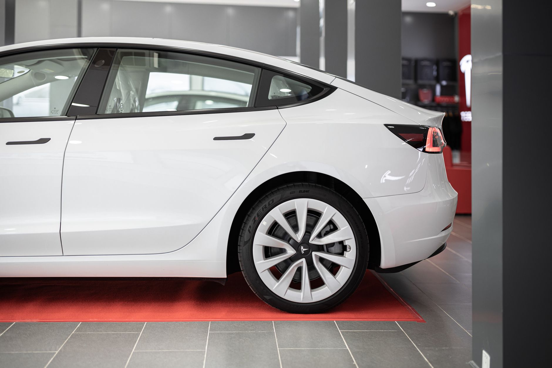 Modern electric vehicle on display inside a car showroom