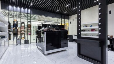 Interior of a high-end luxury fashion boutique with minimalist display cases