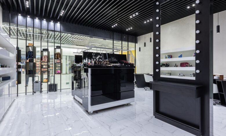 Interior of a high-end luxury fashion boutique with minimalist display cases