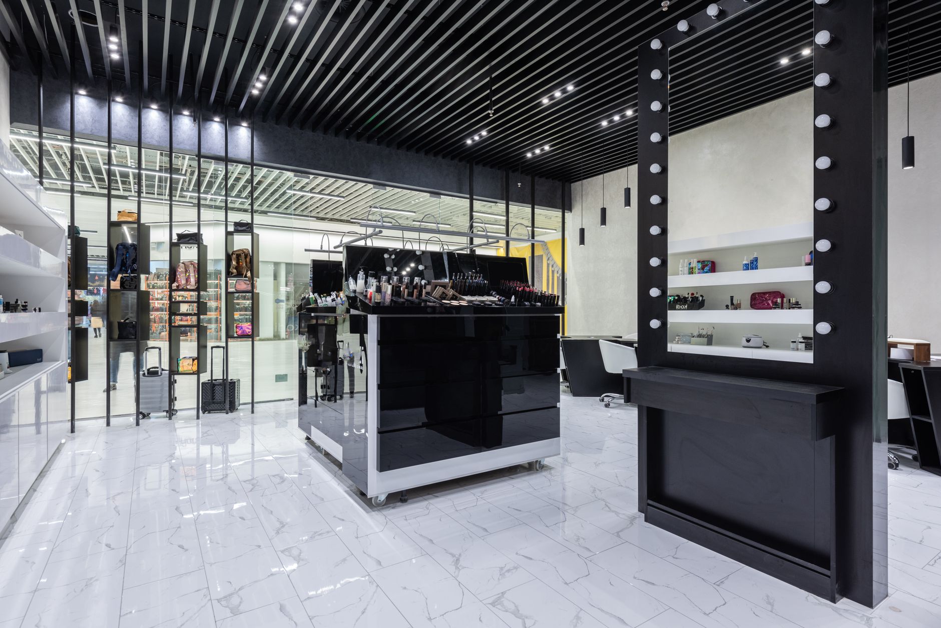Interior of a high-end luxury fashion boutique with minimalist display cases