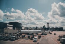 Commercial aircraft parked on airport tarmac awaiting delivery