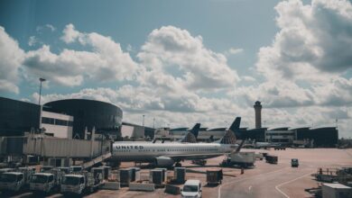 Commercial aircraft parked on airport tarmac awaiting delivery