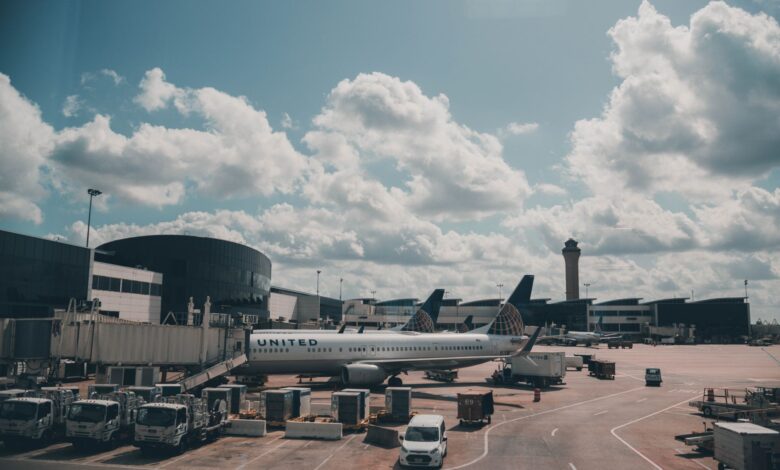 Commercial aircraft parked on airport tarmac awaiting delivery