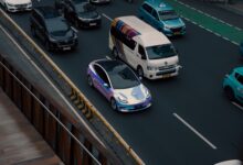 A self-driving electric vehicle navigating an urban street without a driver