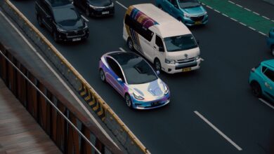 A self-driving electric vehicle navigating an urban street without a driver
