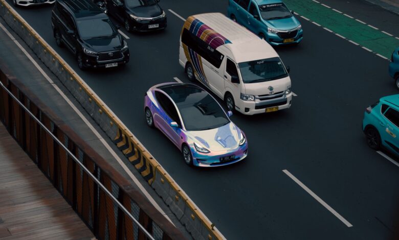 A self-driving electric vehicle navigating an urban street without a driver