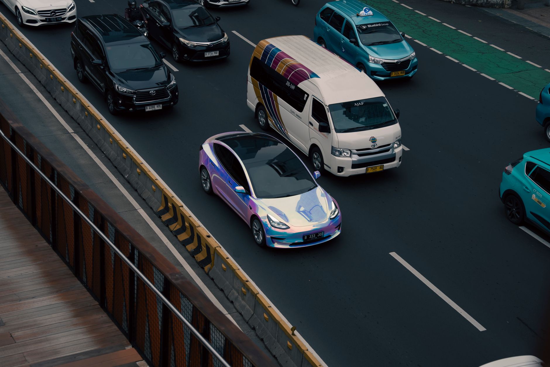 A self-driving electric vehicle navigating an urban street without a driver