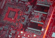 Inside view of a modern semiconductor chip manufacturing facility with clean room equipment
