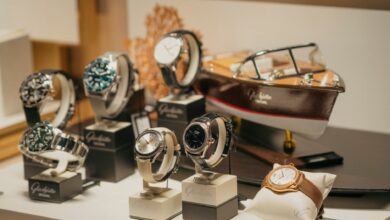 A collection of luxury Swiss watches displayed on a retail counter