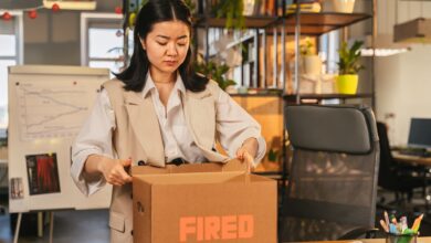Employee clearing desk in a corporate office during a layoff