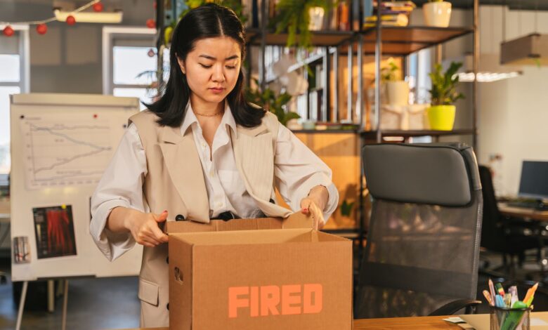 Employee clearing desk in a corporate office during a layoff