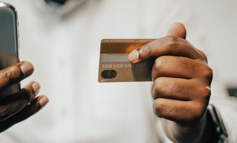Person using smartphone for digital payment at retail checkout