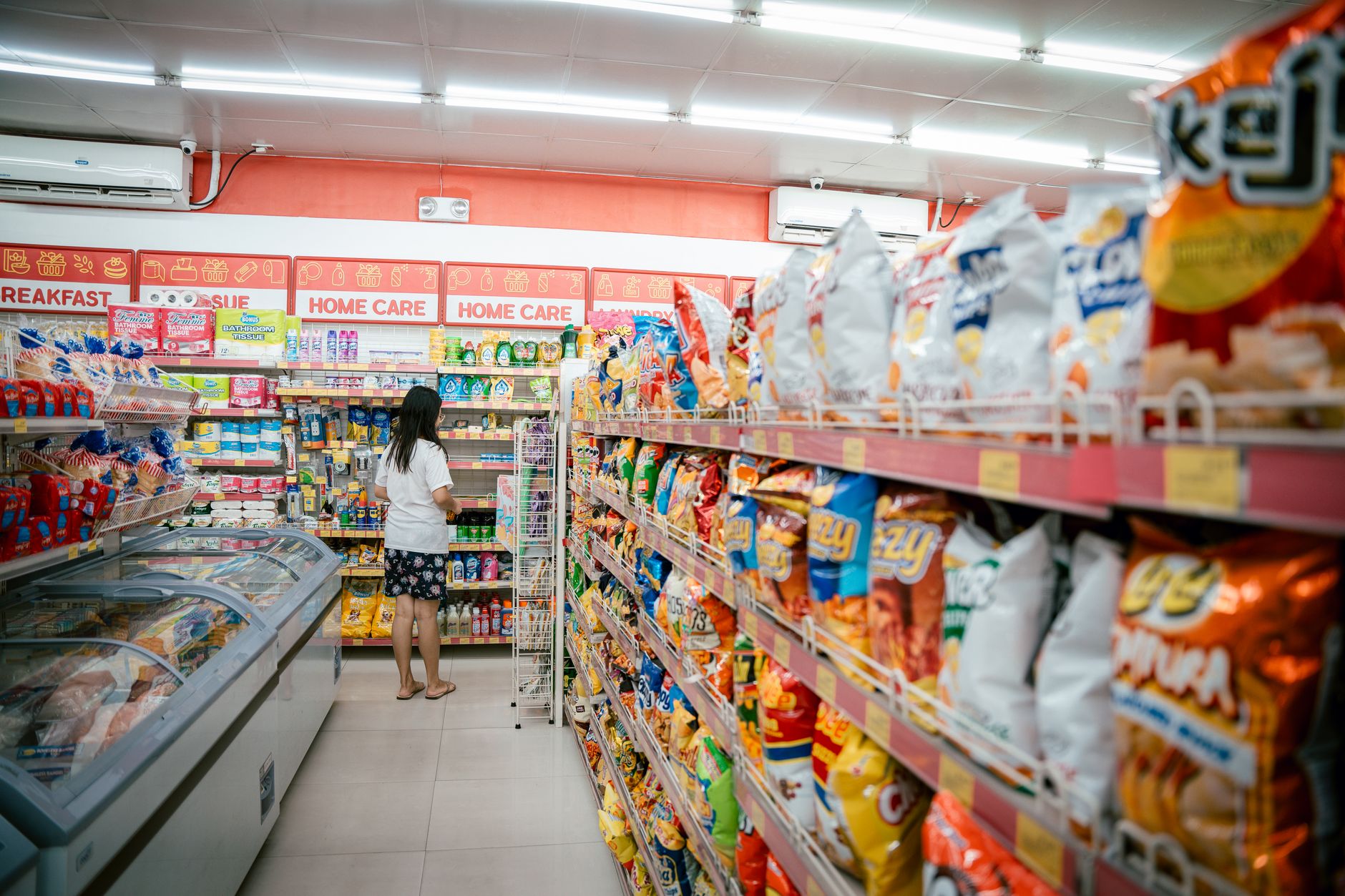Close-up of colorful food products organized on retail supermarket shelves