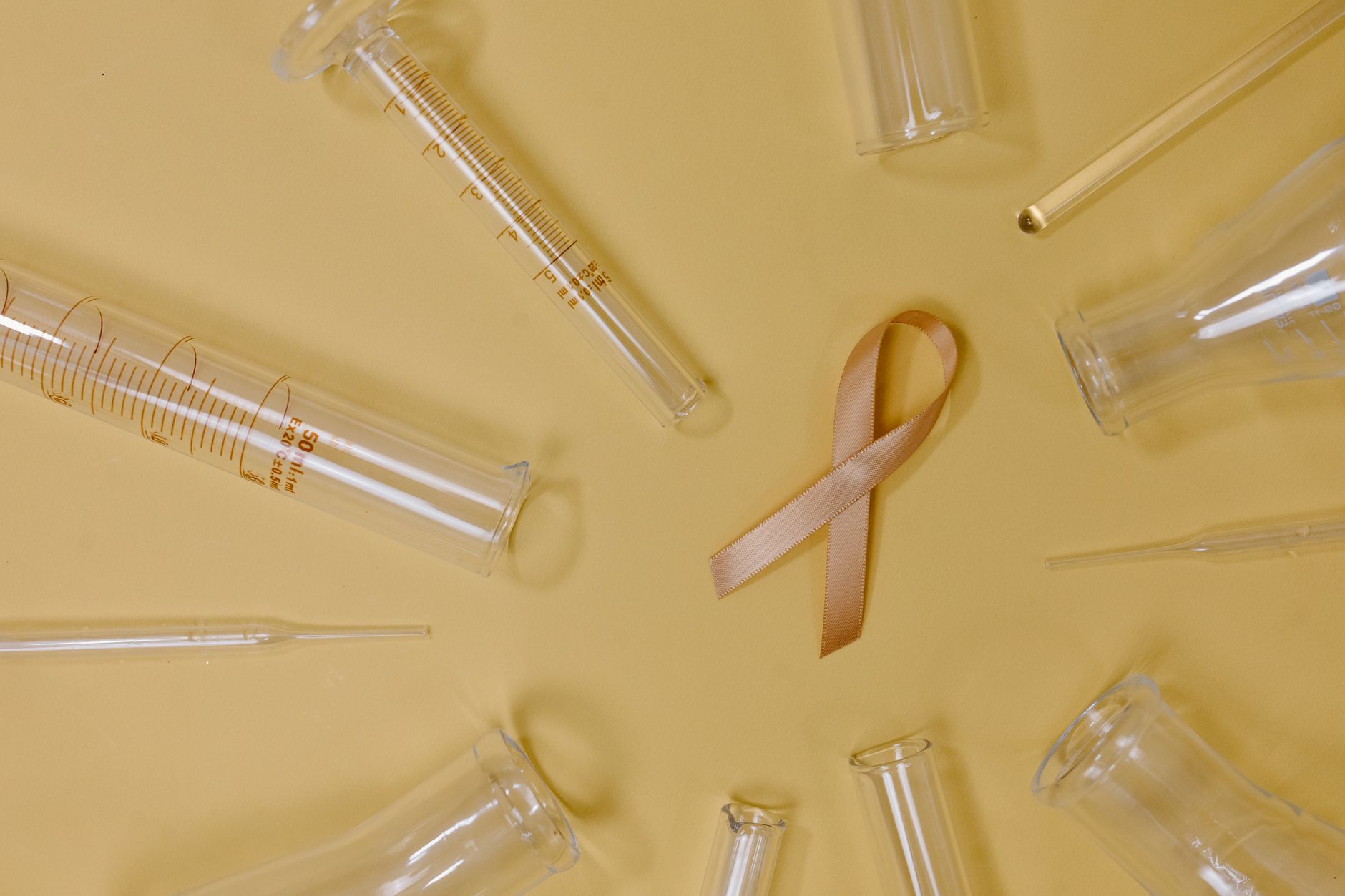 Researcher examining cancer cell samples in a clinical laboratory setting