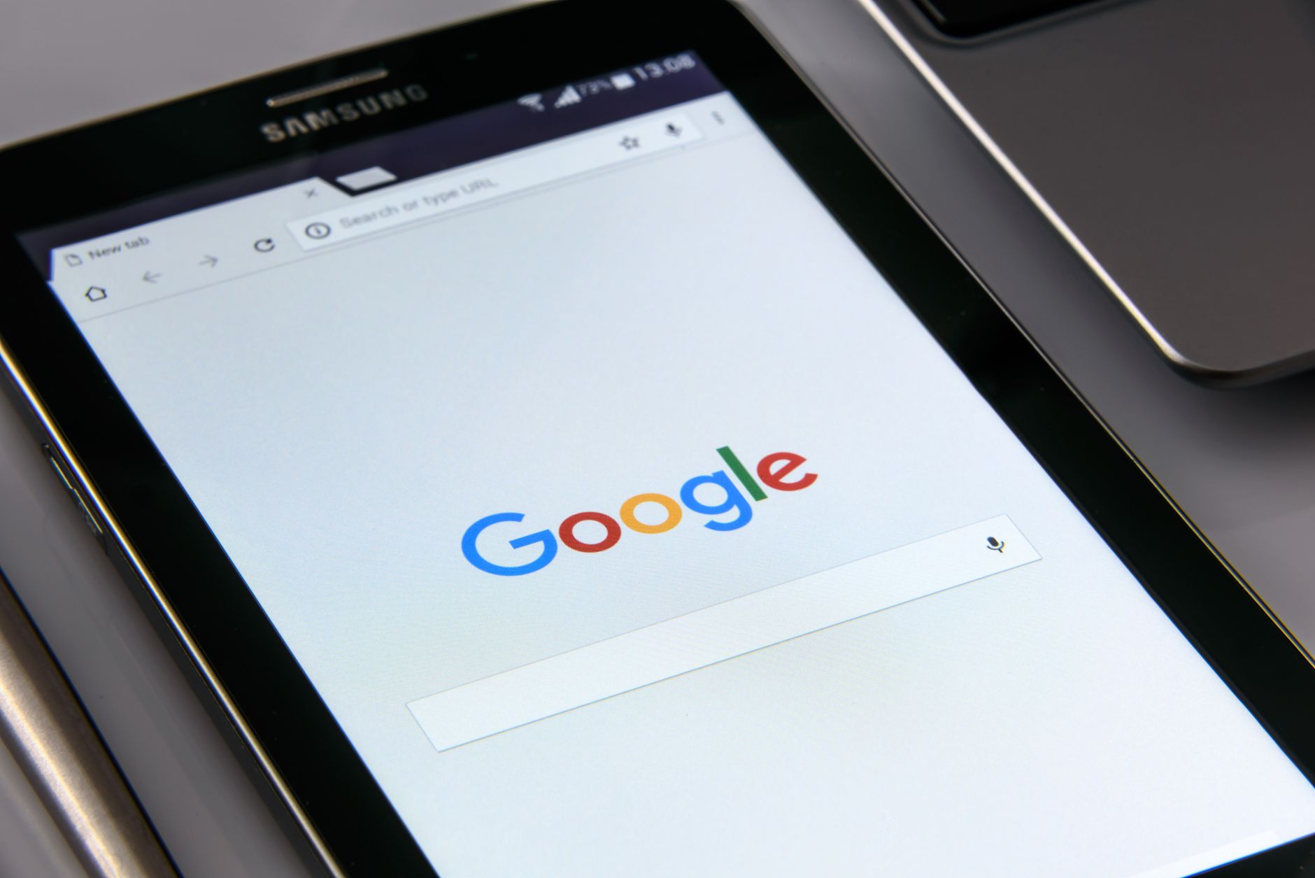 Person using a smartphone browser, illustrating Android and Chrome market reach
