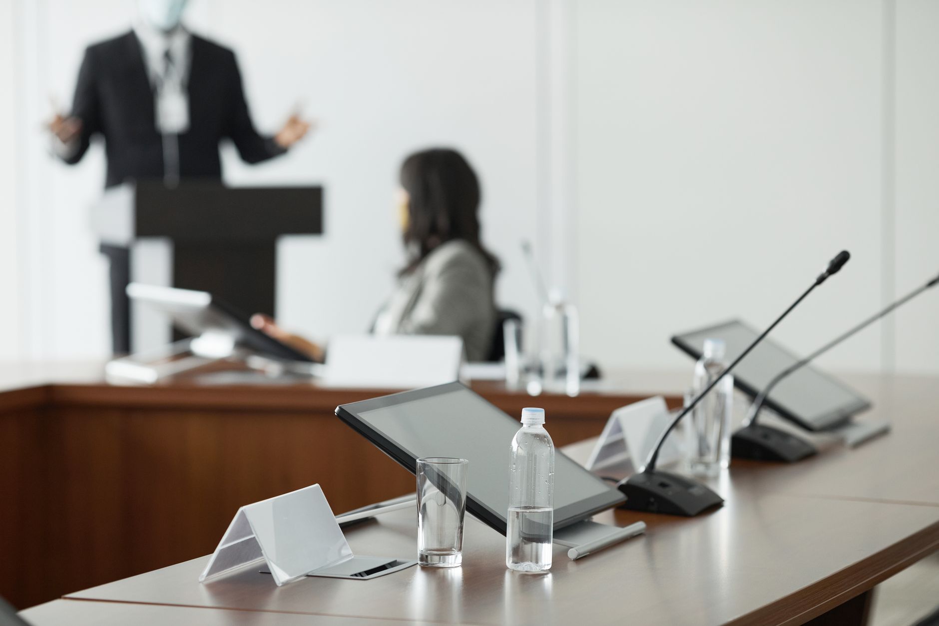 Empty corporate boardroom with chairs around a conference table