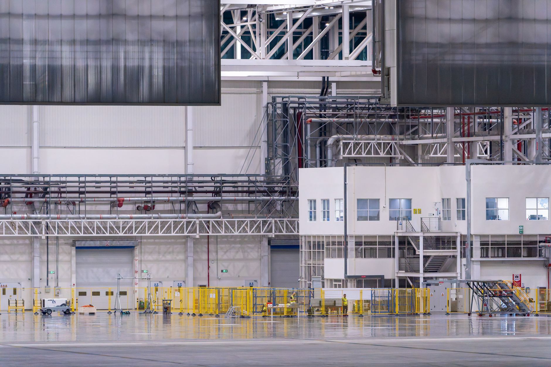 Workers on an aerospace factory floor representing Boeing's spacecraft manufacturing operations