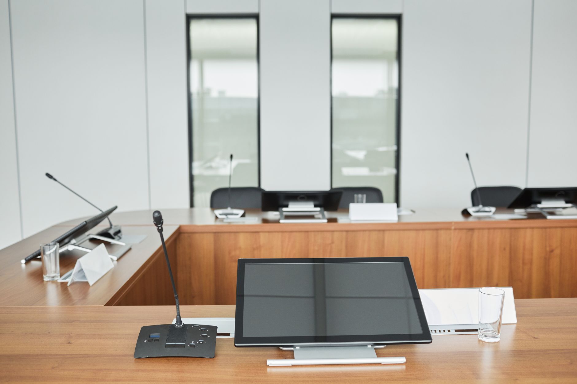 Business executives reviewing financial strategy documents in a boardroom meeting